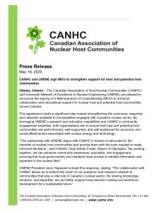The image shows the CANHC and UNENE representatives signing a Memorandum of Understanding to enhance support for host and potential host communities.